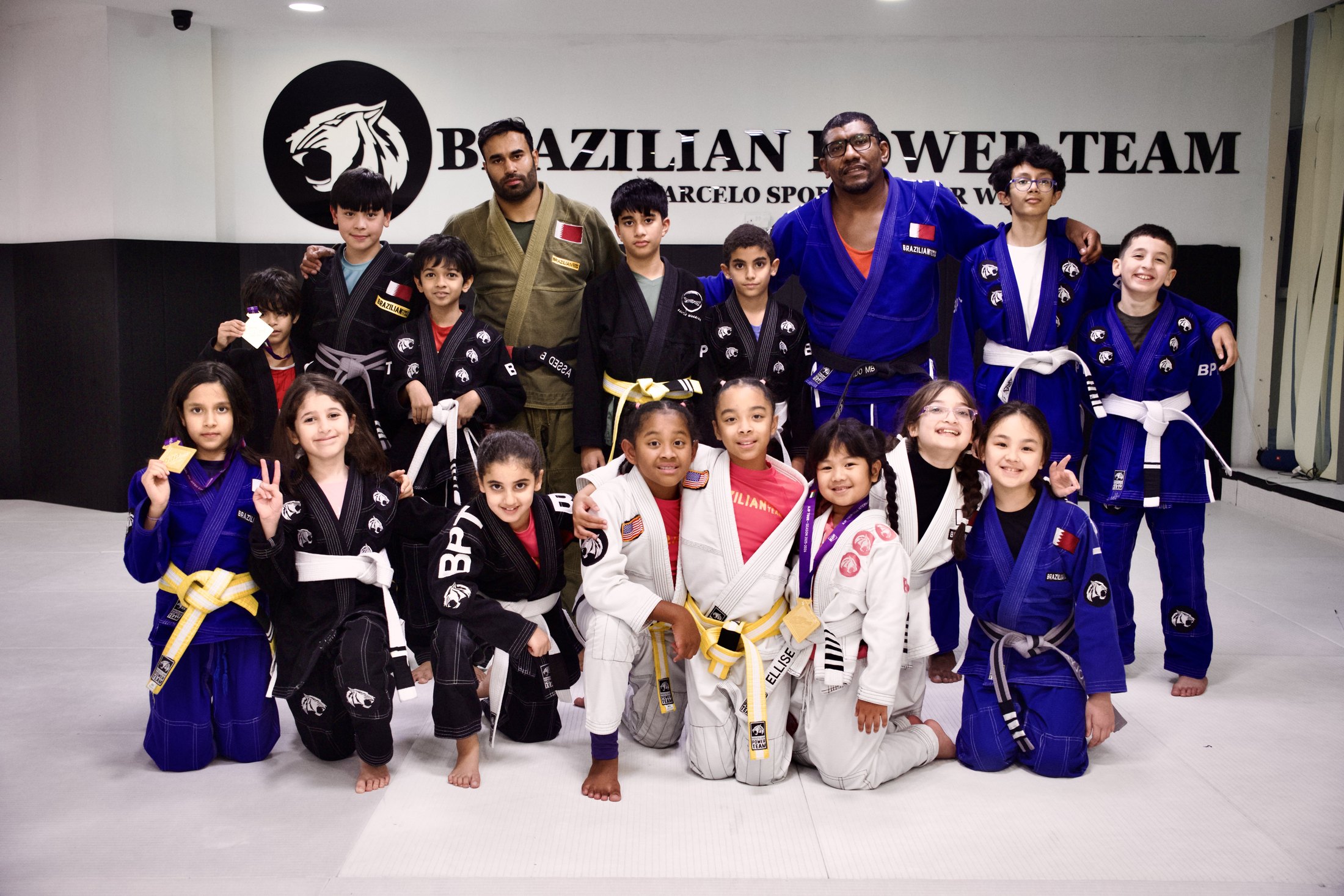 Brazilian Power Team kids team group photo inside the academy